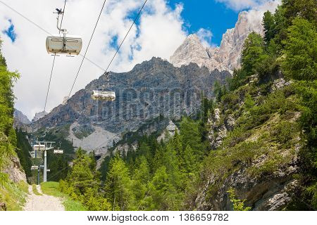 White cable car going to the Monte Cristallo Massif in the Dolomites Italy