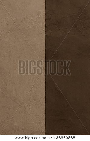 Half colored texture plaster wall exterior dark biege and brown
