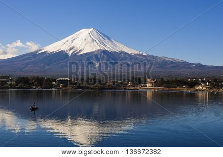Mt Fuji View From The Lake With A Boat And Reflection
