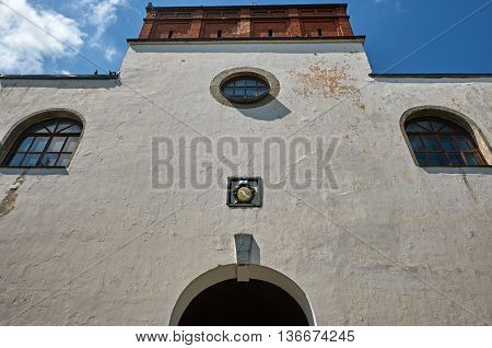 old castle wall with windows blue sky. Ukraine Dubno Carpathian