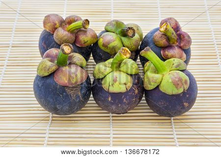 Mangosteen queen of fruits on traditional mat is most popular in Thailand and International