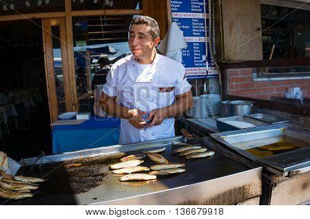 Anadolu Kavagi Turkey - Aug 28 2013: Fish seller street food vendor of grilled bonito fish