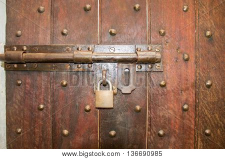 FREMANTLE,WA,AUSTRALIA-JUNE 1,2016:  Prison door detail with brass lock and bolted door in the historic Fremantle Prison in Fremantle, Western Australia.