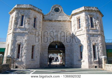 FREMANTLE,WA,AUSTRALIA-JUNE 1,2016:  Fremantle Prison arched entrance with tourists in Fremantle, Western Australia.