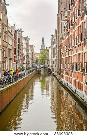 Amsterdam - September 17, 2015: View At The Famous Clock Tower Of The Zuiderkerk Thro Amsterdam Cana