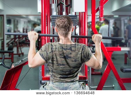 Man Performing Lat Pulldown At The Gym