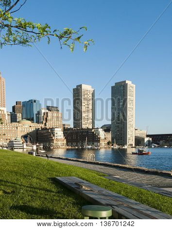 Boston, Massachusetts, USA - June 30, 2016: Small Coast Guard boat patrolling Boston waterfront early morning