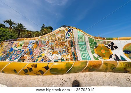 BARCELONA SPAIN - JUNE 10 2014: Detail of ceramic bench in the Park Guell designed by the famous architect Antoni Gaudi (1852-1926). UNESCO World Heritage Site
