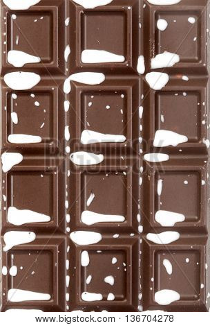 Image of chocolate tile with milk splashes