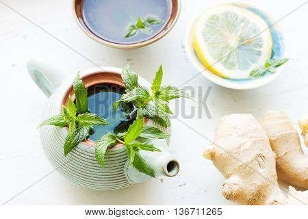 Tea ceremony - lemon ginger tea with mint - teapot with two bowls - pure and fresh look