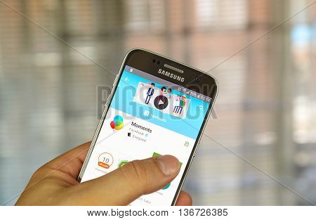 MONTREAL CANADA - JUNE 24 2016 : Facebook Moments application on Samsung S7 screen. Facebook Moments is intended to be a photo-sharing app designed to make both sharing and managing of photos