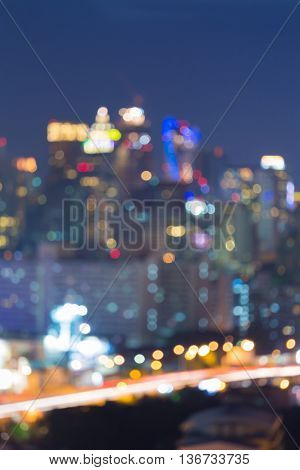 Abstract blurred lights night view, city office building and raod