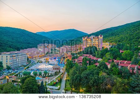Beautiful Sundown Summer High Angle View Of Hotels, Apartments, Parking, Aquapark, Mountain And Fore