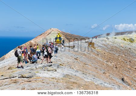 VULCANO ITALY - MAY 24: Rescue helicopter and people at top of volcano on May 24 2016 at Vulcano Island near Sicily Italy
