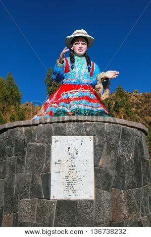 CHIVAY PERU-JANUARY 15: Statue of a local woman spinning wool on January 15 2015 in Chivay Peru. Chivay is the capital of the Caylloma province.