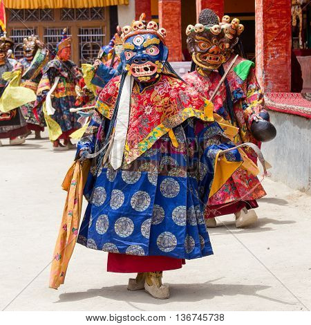LAMAYURU INDIA - JUNE 13 2015: Unidentified buddhist lamas dressed in mystical mask dancing Tsam mystery dance in time of Yuru Kabgyat Buddhist festival at Lamayuru Gompa Ladakh North India