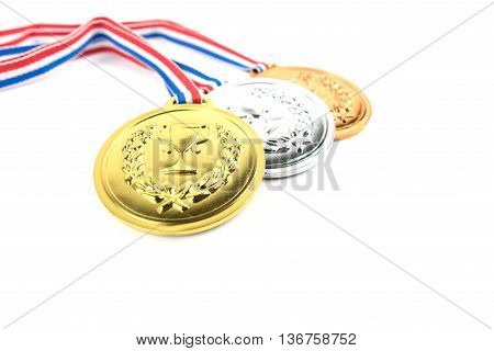 Gold silver and bronze medals with trophy symbol on white background