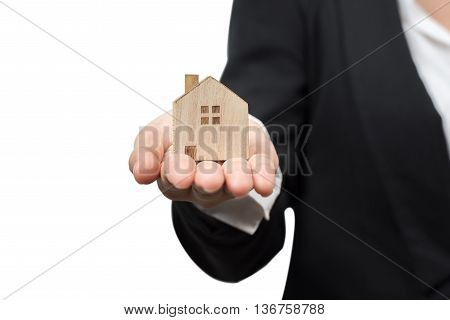 Business woman presenting house model in her hand isolated on white with clipping path. real estate concept