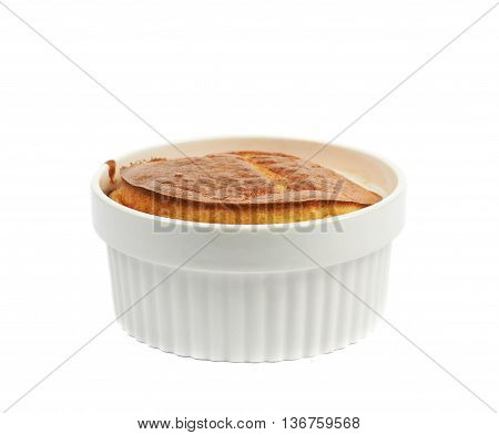 Cheese souffle in a white ceramic ramekin, composition isolated over the white background