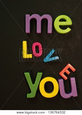 Love is falling apart message in vibrant colorful magnet letters