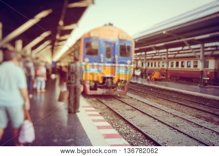 People waiting for the train at the railway station ,train station -soft focus and blur concept