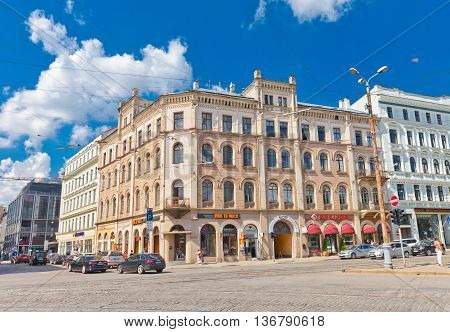 RIGA LATVIA - JUNE 29 2016: Old residential house (circa 19th c.) on the Aspazijas (former Theater) Boulevard in the historic center of Riga Latvia. World Heritage Site of UNESCO