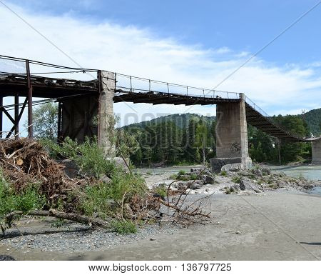 Bridge over the river after floods in mountainous terrain