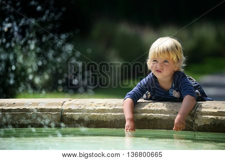 Little girl smile in a green park