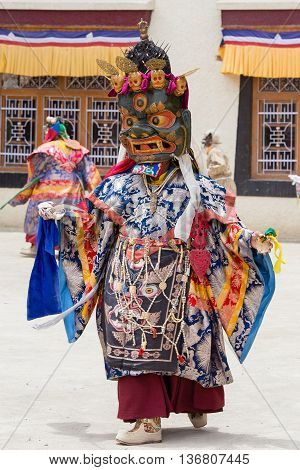 LAMAYURU INDIA - JUNE 13 2015: Unidentified buddhist lamas dressed in mystical mask dancing Tsam mystery dance in time of Yuru Kabgyat Buddhist festival at Lamayuru Gompa Ladakh North India