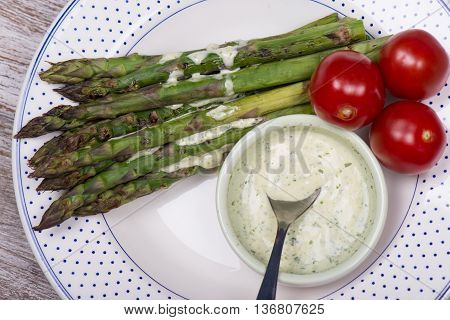 Baked green asparagus, cherry tomato and dragon mayonaise