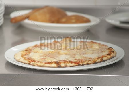 Traditional way baked wood fired oven Italian pizza bakery pizzeria.