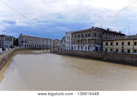 beautiful riverfront seen from a bridge in the city of senigallia
