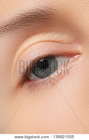 Female Eye With Long Eyelashes Close-up. Blue Eye