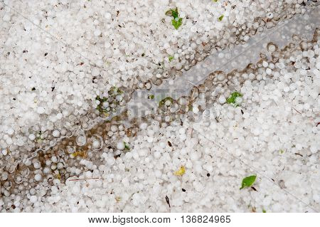 hail, mud and water on the ground after hurricane