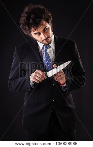 Mad Businessman Holding A Kitchen Knife