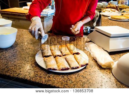 cooking sweet strudel with berries in a cafe