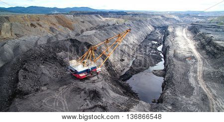 Dragline on open pit coal mine in Russia