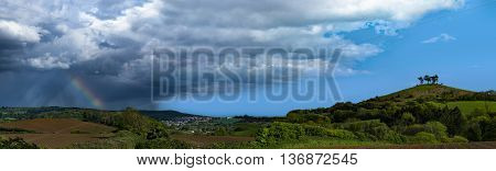 Dorset countryside around Colmer's Hill under blue skies with a rainbow