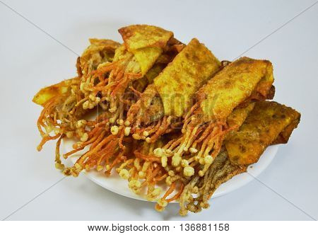 Enokitake mushroom fried wonton wrapper on dish