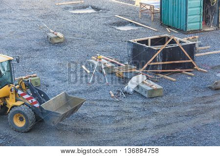 View of a construction site with various machines and bulldozers