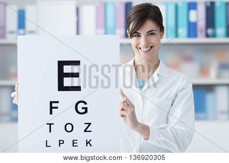 Professional Oculist Holding An Eye Chart