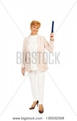Smile elderly woman pointing up with hege pen