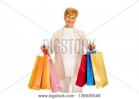 Happy business woman holging shopping bags