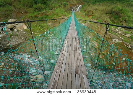 Common bridge walkway to cross river in Borneo interior