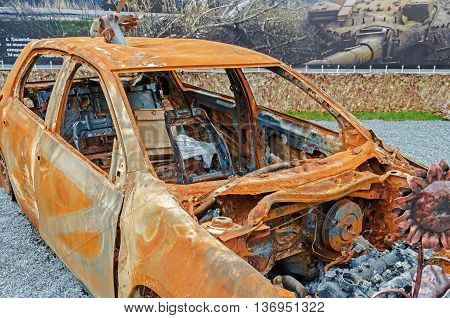 Dnepropetrovsk Ukraine - May 19 2016: Open air museum dedicated to war in the Donbass. Burned car as a result of war in the Donbass