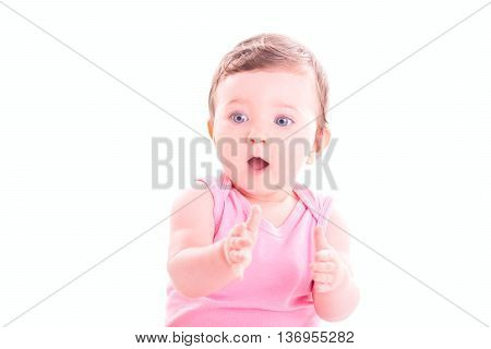 Baby girl clap her hands on white background.
