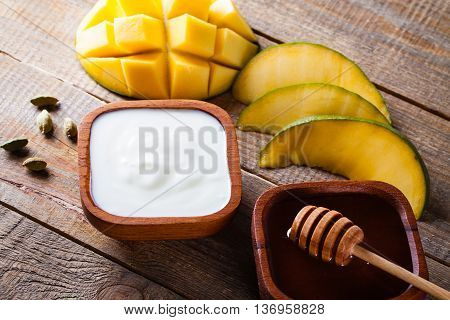 Ingredients for preparation the Indian specialty mango lassi.