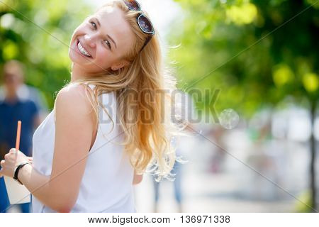 Portrait of pretty girl threw back her head