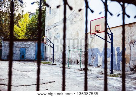 abandoned Basketball court backyard with concrete floor