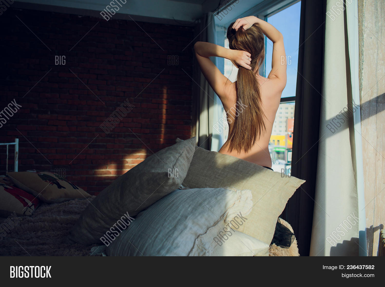 Naked Women Looking Behind Her